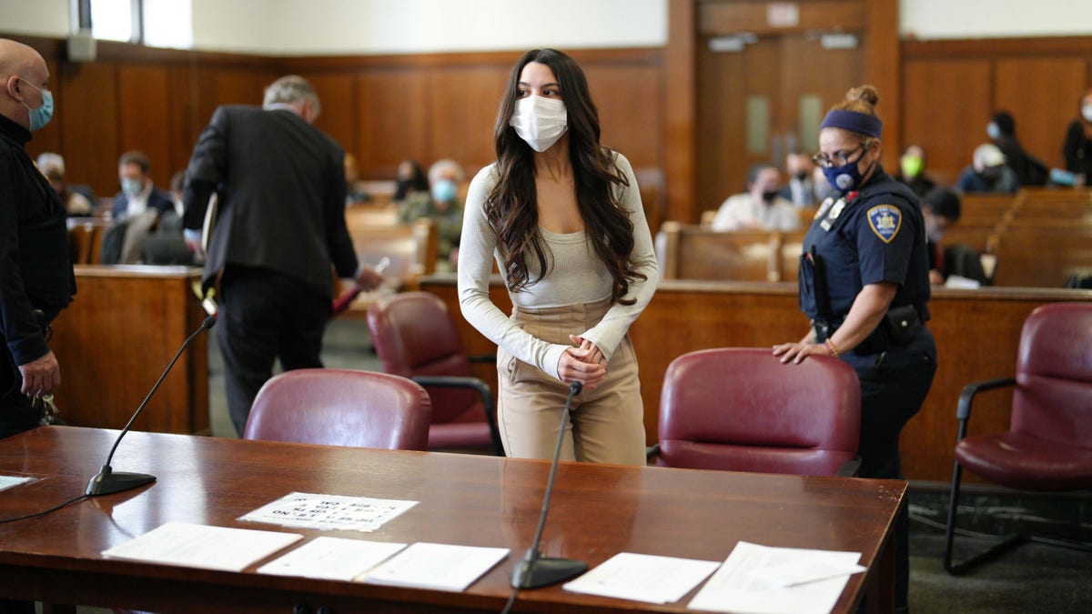 Miya Ponsetto stands at her hearing