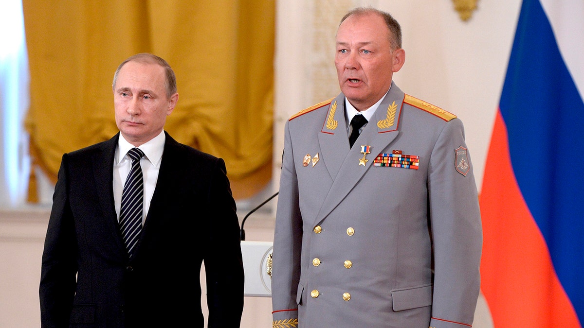 Russian President Vladimir Putin, left, poses with Col. Gen. Alexander Dvornikov during an awarding ceremony in Moscow's Kremlin, Russia.