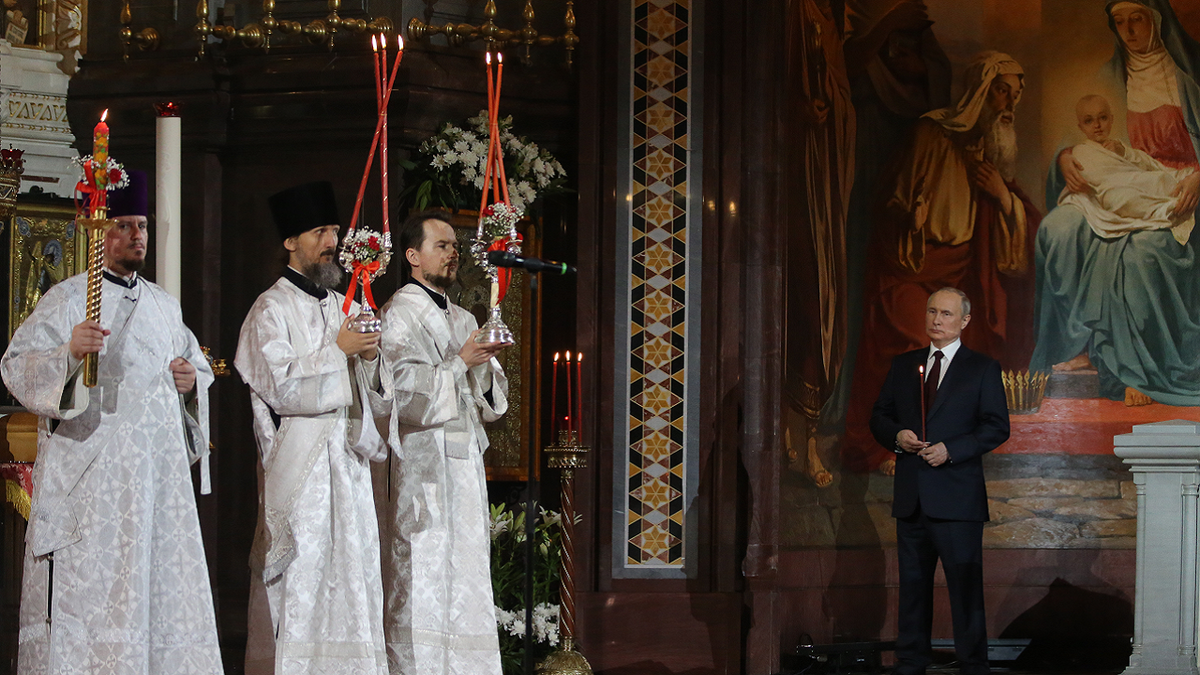 Russian President Vladimir Putin attends Orthodox Easter mass led by Russian Orthodox Patriarch Kirill at the Christ The Saviour Cathedral on Sunday, April 24 in Moscow, Russia.