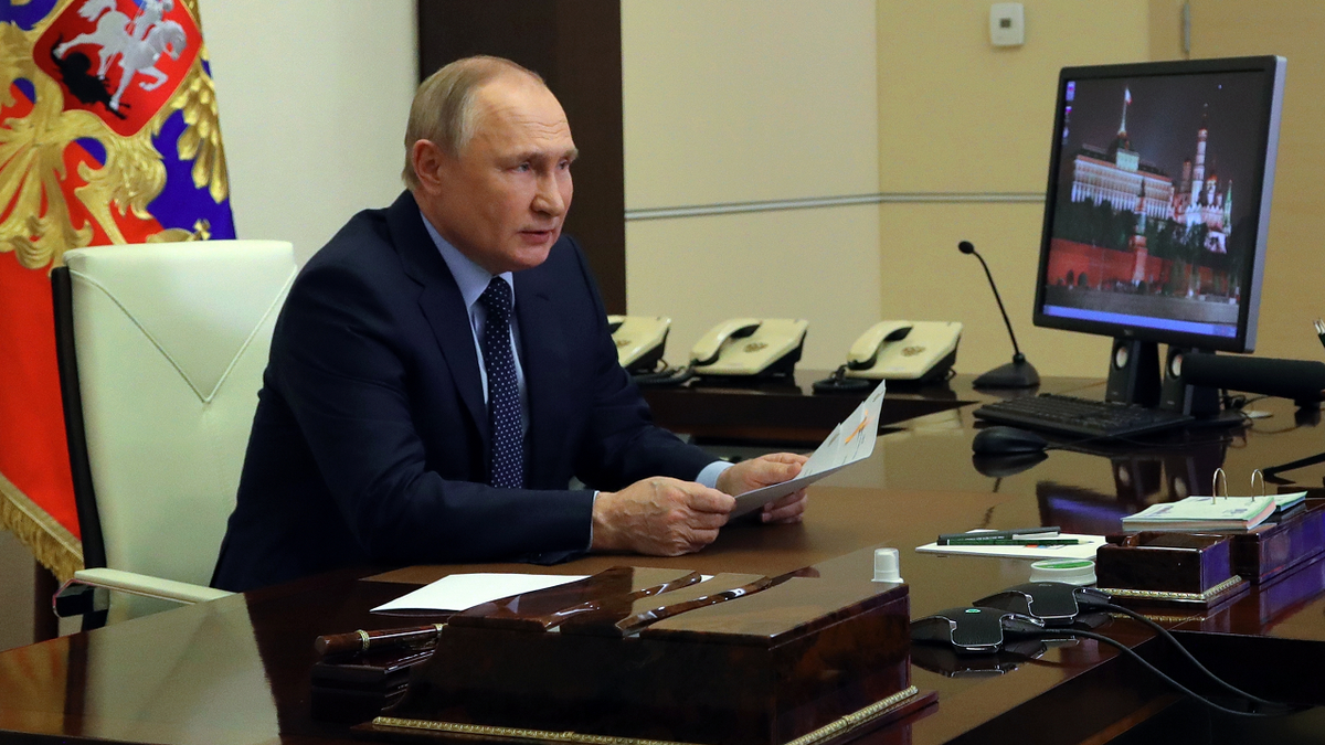 Russian President Vladimir Putin chairs a Security Council meeting via videoconference at the Novo-Ogaryovo residence outside Moscow, Russia, on Friday.