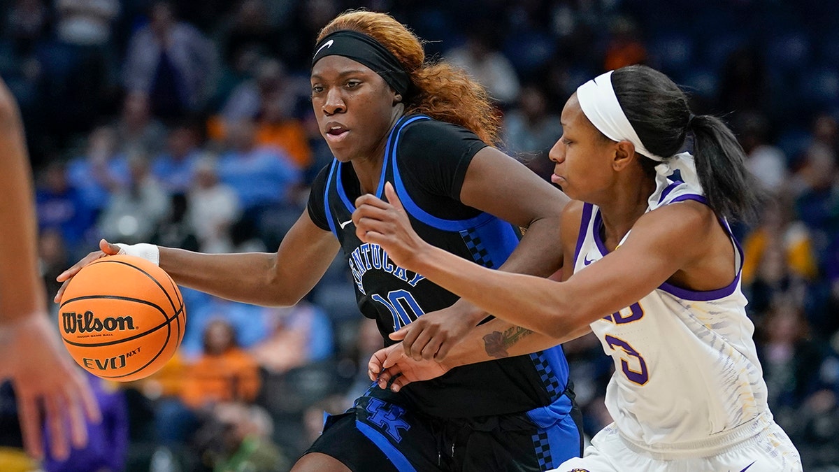 FILE - Kentucky's Rhyne Howard (10) is guarded by LSU's Khayla Pointer (3) in the second half of an NCAA college basketball game at the women's Southeastern Conference tournament Friday, March 4, 2022, in Nashville, Tenn. Howard is expected to be drafted high in the WNBA draft on Monday, April 11, 2022.
