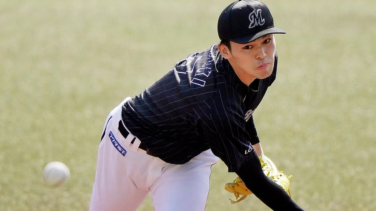 FILE - Chiba Lotte Marines Roki Sasaki pitches during a game against the Orix Buffaloes in Chiba, near Tokyo, Sunday, April 10, 2022. 
