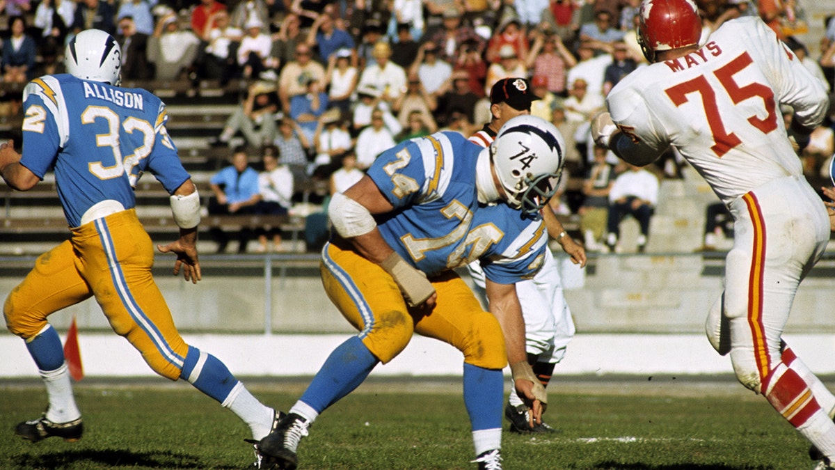 Offensive tackle Ron Mix (74) of the San Diego Chargers blocks Chiefs defensive lineman Jerry Mays (75) in a 27 to 17 loss to the Kansas City Chiefs on December 18, 1966 at San Diego Stadium in San Diego, California.