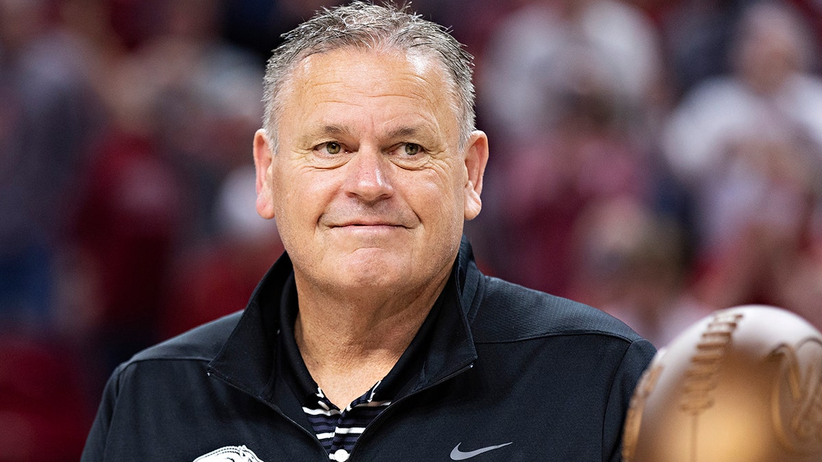 Head Football Coach Sam Pittman of the Arkansas Razorbacks calls the Hogs during a basketball game against the South Carolina Gamecocks at Bud Walton Arena on January 18, 2022 in Fayetteville, Arkansas. The Razorbacks defeated the Gamecocks 75-59. 