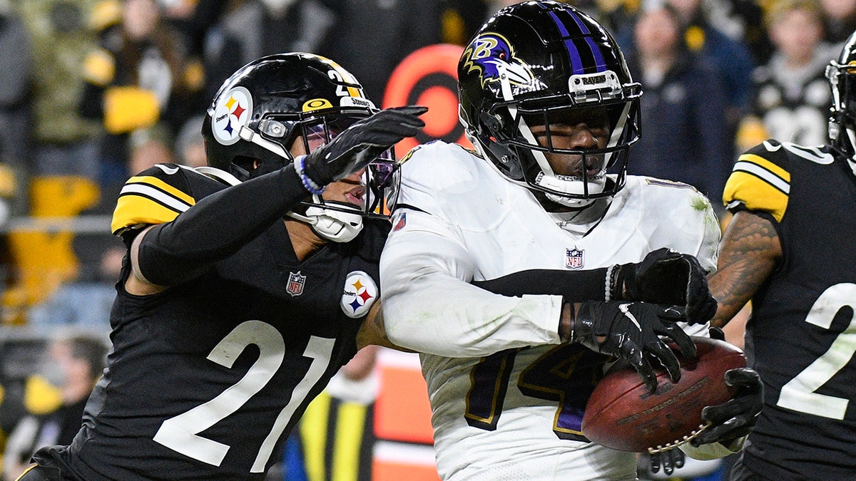 FILE - Baltimore Ravens wide receiver Sammy Watkins (14) makes a touchdown catch as Pittsburgh Steelers cornerback Tre Norwood (21) defends during the second half of an NFL football game Dec. 5, 2021, in Pittsburgh.