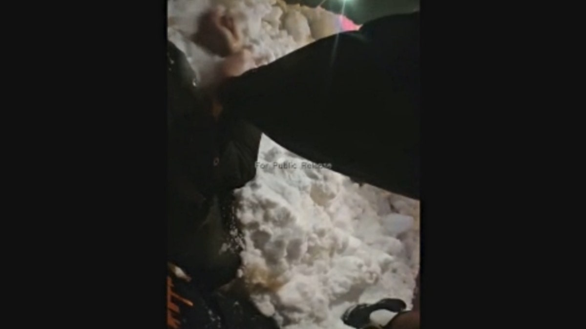 Purdue Officer Jon Selke pins Adonis Tuggle to a snow bank in newly released body camera footage.
