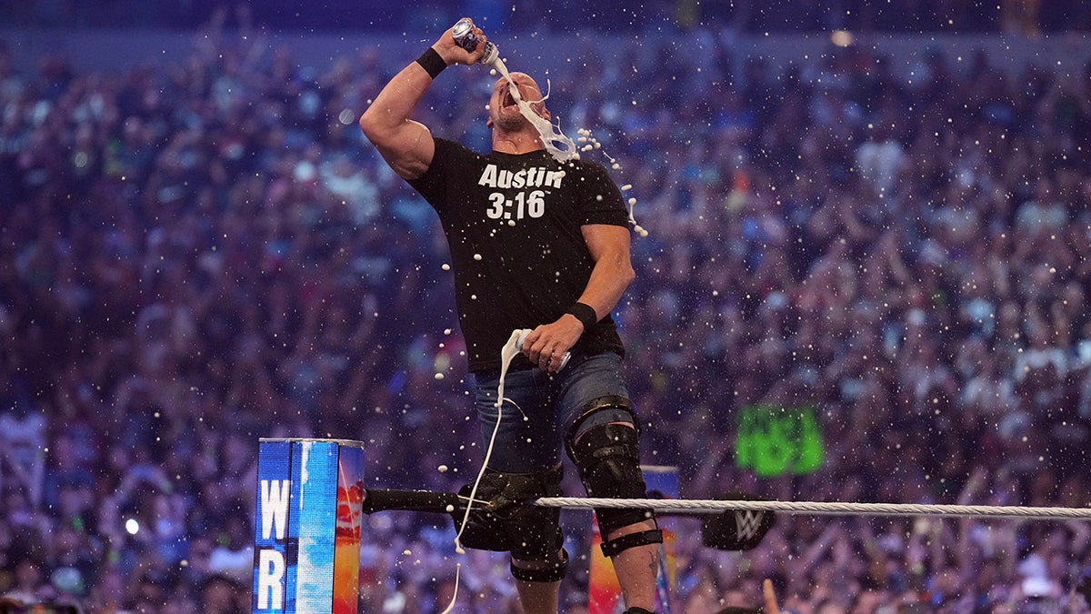 Stone Cold Steve Austin celebrates with beer during WrestleMania at AT&T Stadium in Arlington, Texas, on Apr 3, 2022.