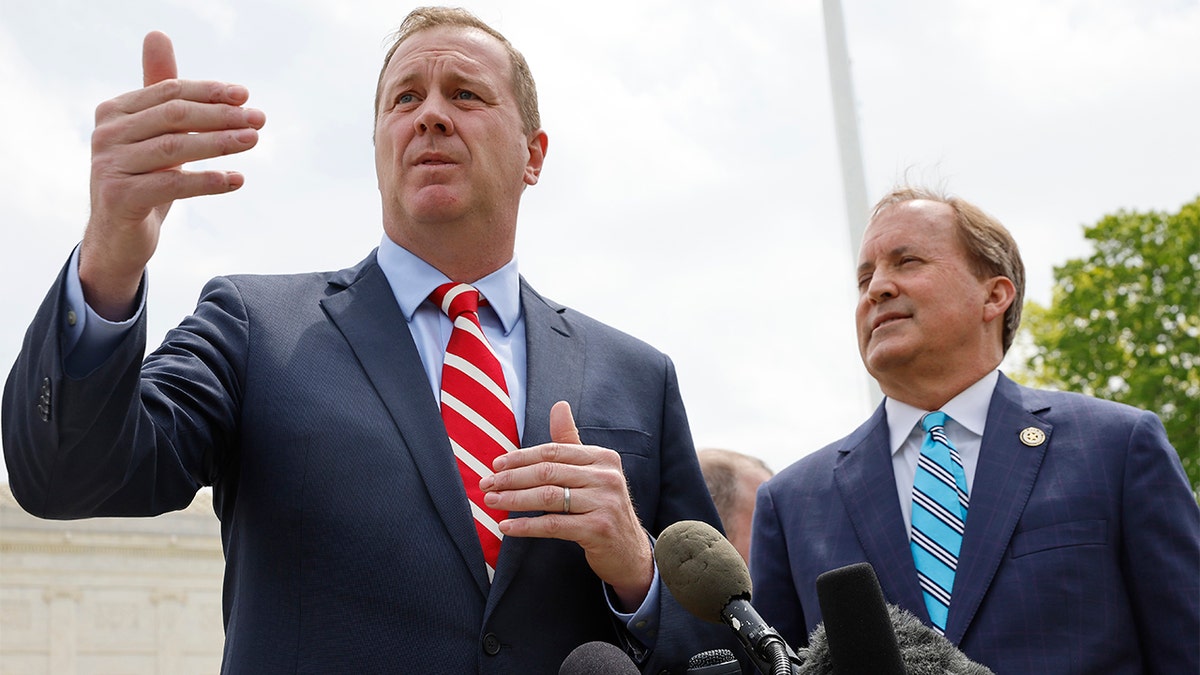 Missouri Attorney General Eric Schmitt talks to reporters with Texas Attorney General Ken Paxton after the U.S. Supreme Court heard arguments in their case about Title 42 on April 26, 2022 in Washington, D.C. Paxton and Schmitt, who is running for the U.S. Senate, are suing to prevent the Centers for Disease Control and Prevention from lifting Title 42, a coronavirus pandemic health order used by federal immigration officials to expel migrants at the U.S.-Mexico border. (Photo by Chip Somodevilla/Getty Images)