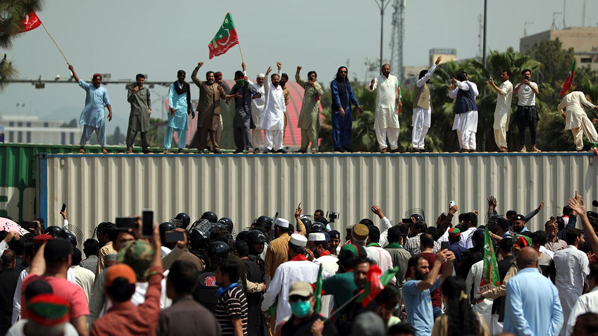 Supporters of ruling party Pakistan Tehreek-e-Insaf (PTI) chant slogans during a protest in Islamabad, Pakistan, Sunday, April 3, 2022. Pakistan's embattled Prime Minister Imran Khan said Sunday he will seek early elections after sidestepping a no-confidence challenge and alleging that a conspiracy to topple his government had failed. (AP Photo/Rahmat Gul)