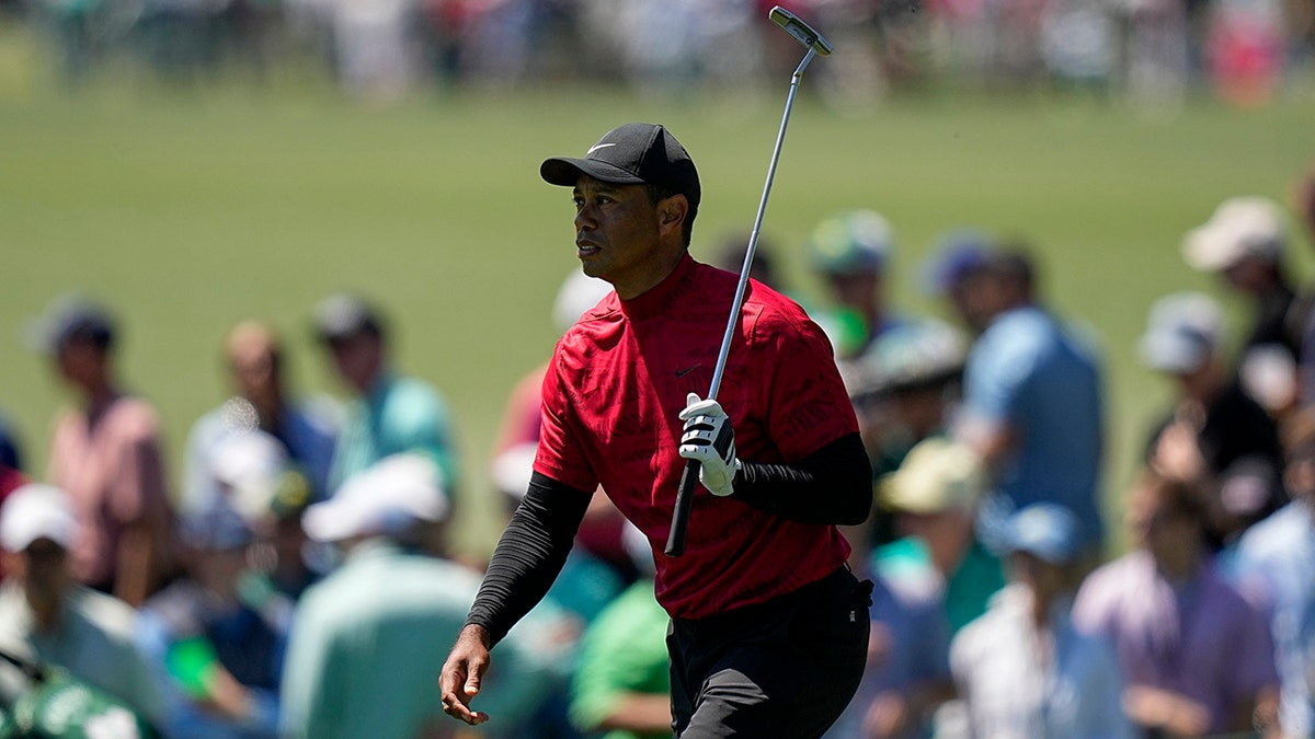 Tiger Woods walks up the ninth fairway during the final round at the Masters golf tournament on Sunday, April 10, 2022, in Augusta, Ga.