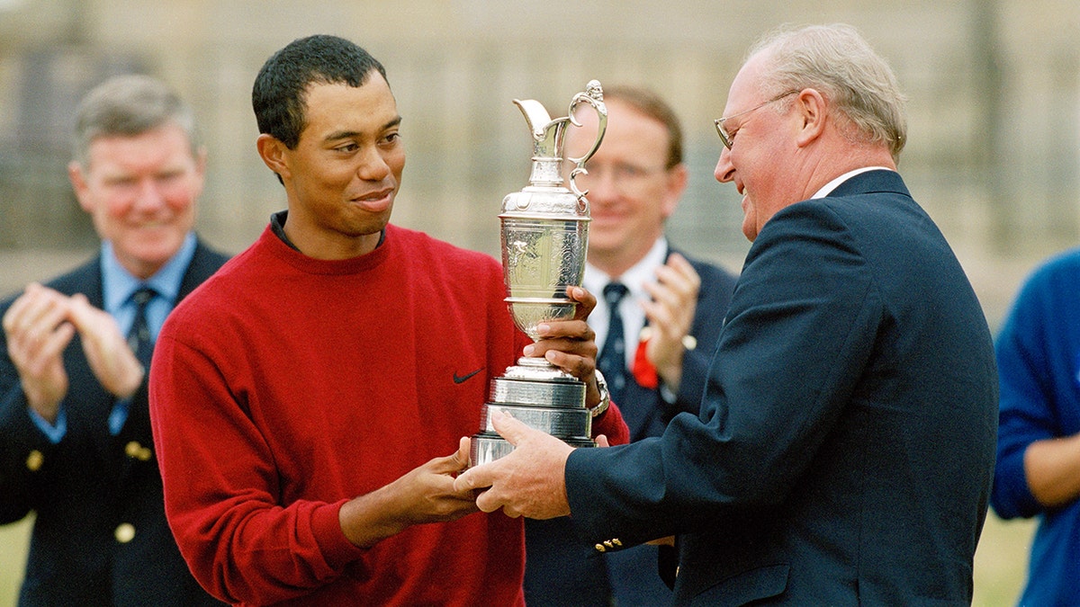 Tiger Woods of the USA receives the Claret Jug from Sir Michael Bonallack the Captain of the Royal and Ancient Golf Club of St Andrews after his victory in the 2000 Open Championship held on the Old Course at St Andrews on July 23, 2000 in St Andrews, Scotland.