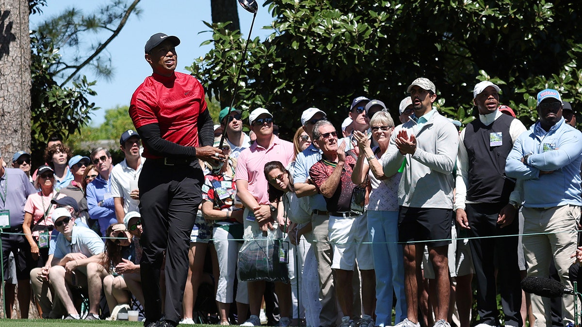 Tiger Woods tees off