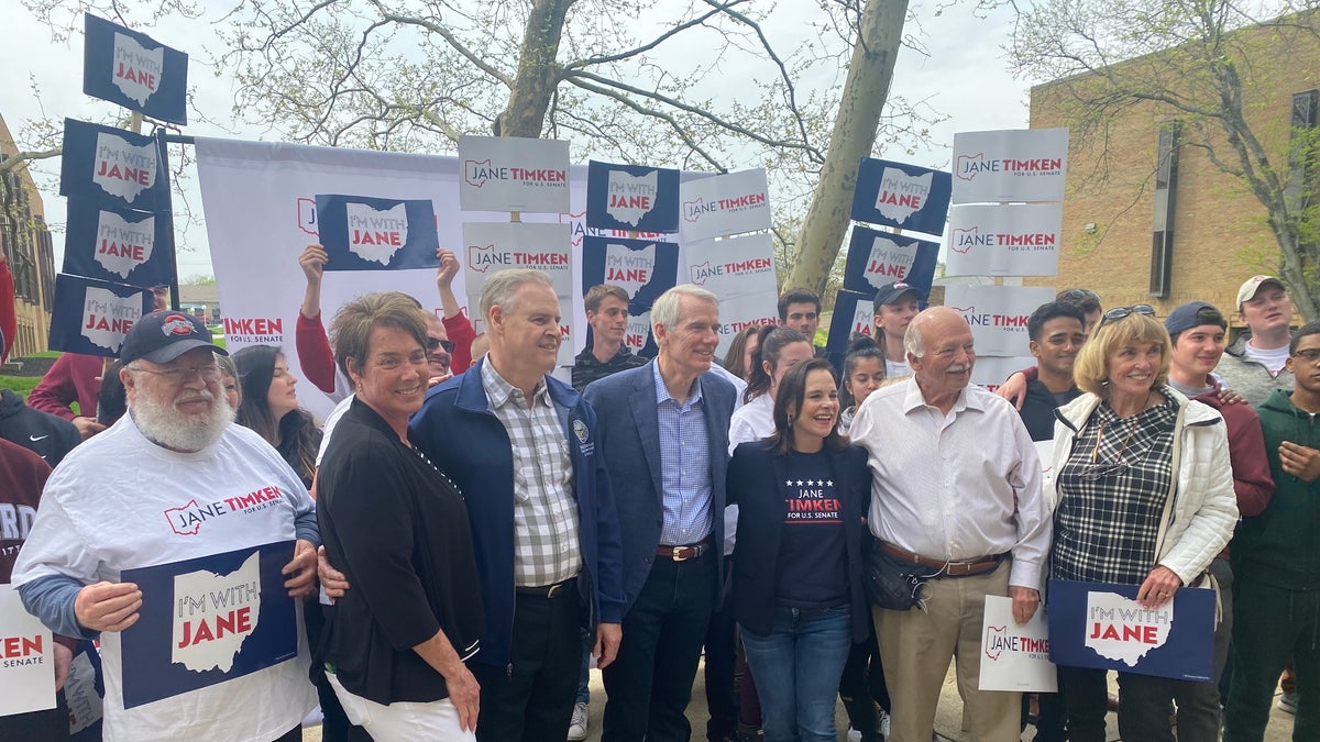 Sen. Rob Portman R-Ohio, and Ohio GOP Senate candidate Jane Timken pose with volunteers at Timken's campaign headquarters on April 30, 2022. (Tyler Olson/Fox News)