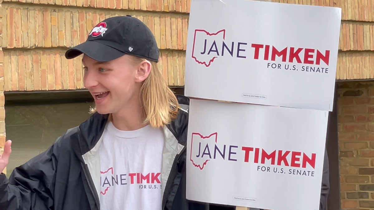 A supporter of Ohio GOP Senate candidate Jane Timken waves to her as she walks out to address volunteers at a rally with Sen. Rob Portman, R-Ohio, at her campaign headquarters in Columbus, on April 30, 2022. (Tyler Olson/Fox News)