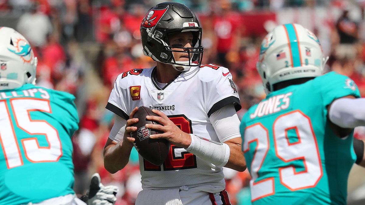 Tampa Bay Buccaneers Quarterback Tom Brady (12) looks for an open receiver during the regular season game between the Miami Dolphins and the Tampa Bay Buccaneers on Oct. 10, 2021 at Raymond James Stadium in Tampa, Florida.