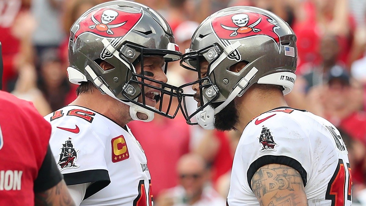 Tampa Bay Buccaneers Quarterback Tom Brady (12) congratulates Wide Receiver Mike Evans (13) after scored a touchdown during the regular season game between the Atlanta Falcons and the Tampa Bay Buccaneers on Sept. 19, 2021 at Raymond James Stadium in Tampa, Florida.