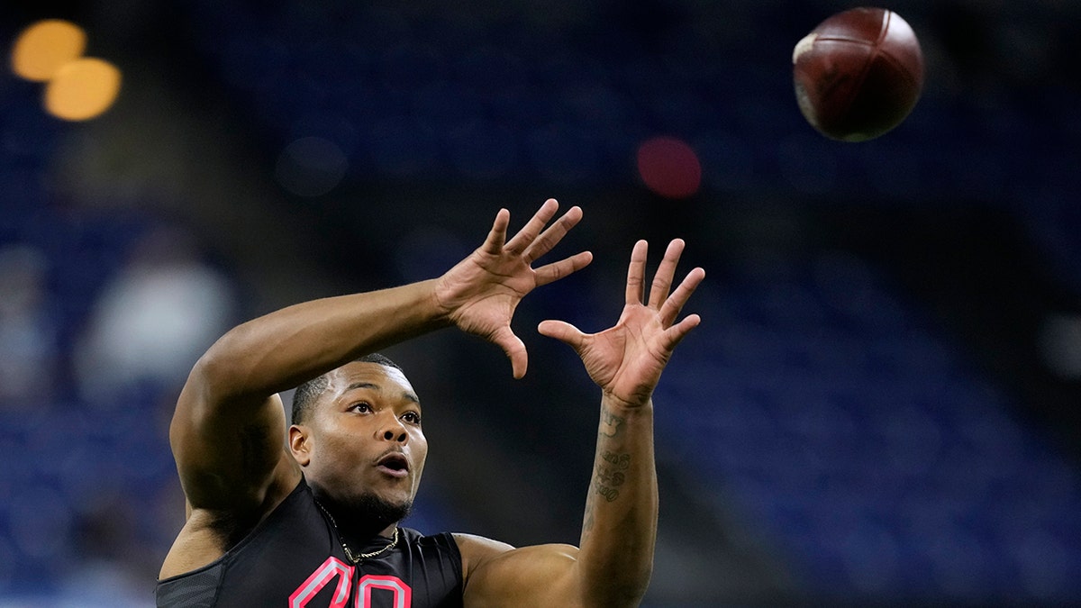 Georgia defensive lineman Travon Walker catches a pass during a drill at the NFL football scouting combine, Saturday, March 5, 2022, in Indianapolis.