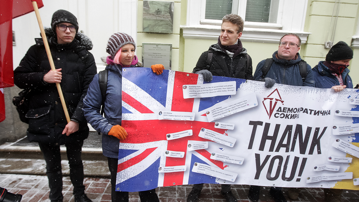 Ukrainians hold a banner as they take part at a rally to thank Great Britain for supplying Ukraine with weapons, outside the British Embassy in Kyiv, Ukraine on Jan. 21.