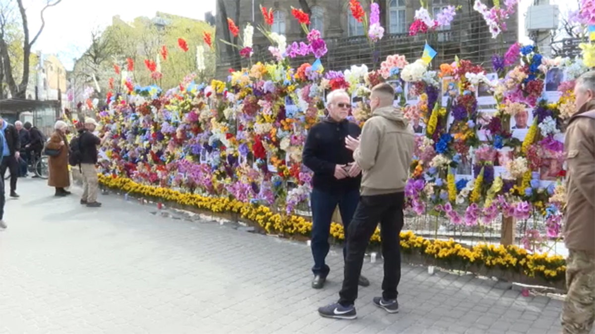 An American in Ukraine helped create a tribute wall for victims of Russia's war.