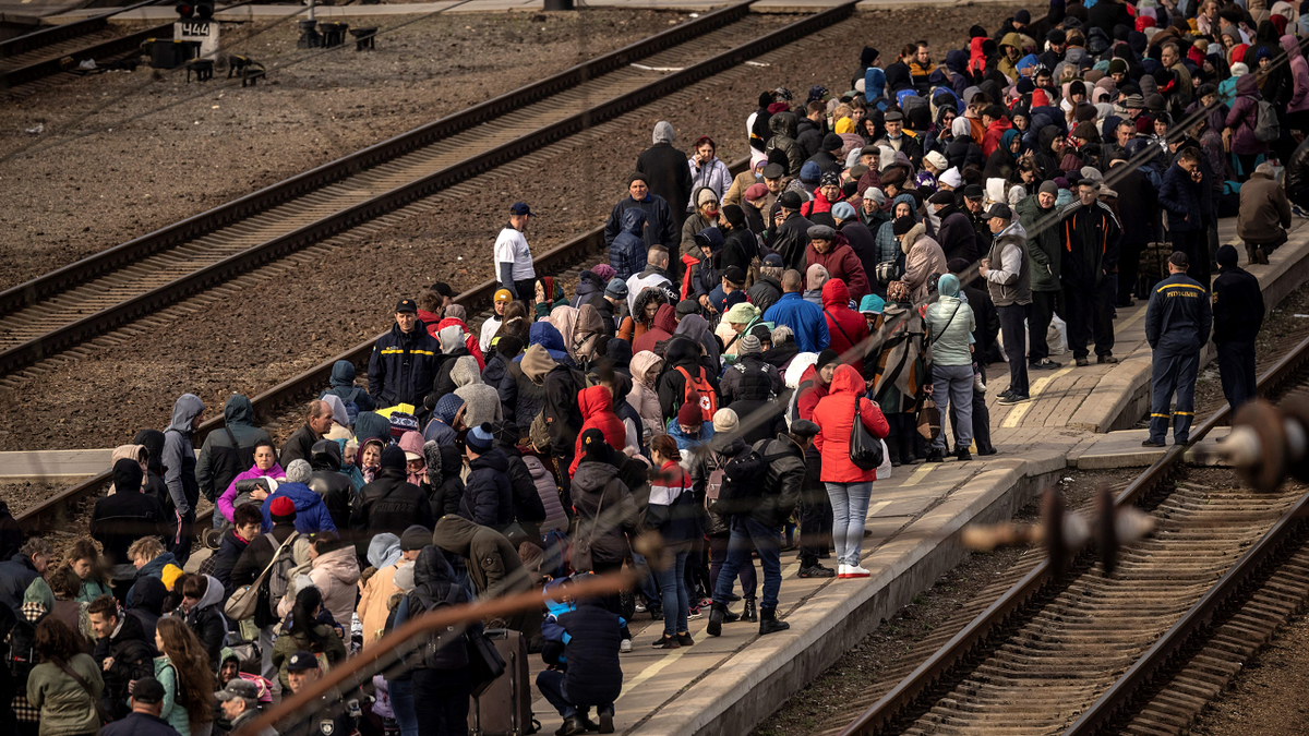 Families wait to board a train at Kramatorsk central station as they flee the eastern city of Kramatorsk, in the Donbas region, in early April.