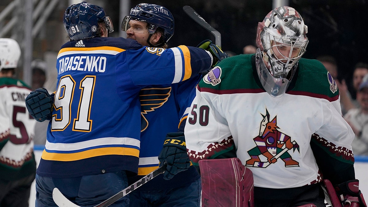 St. Louis Blues' Vladimir Tarasenko (91) is congratulated by teammate Robert Thomas after scoring past Arizona Coyotes goaltender Ivan Prosvetov (50) during the second period of an NHL hockey game Monday, April 4, 2022, in St. Louis.