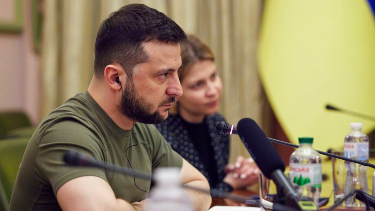 Ukrainian President Volodymyr Zelenskyy sits at a meeting with President of the European Parliament Roberta Metsola in Kyiv.