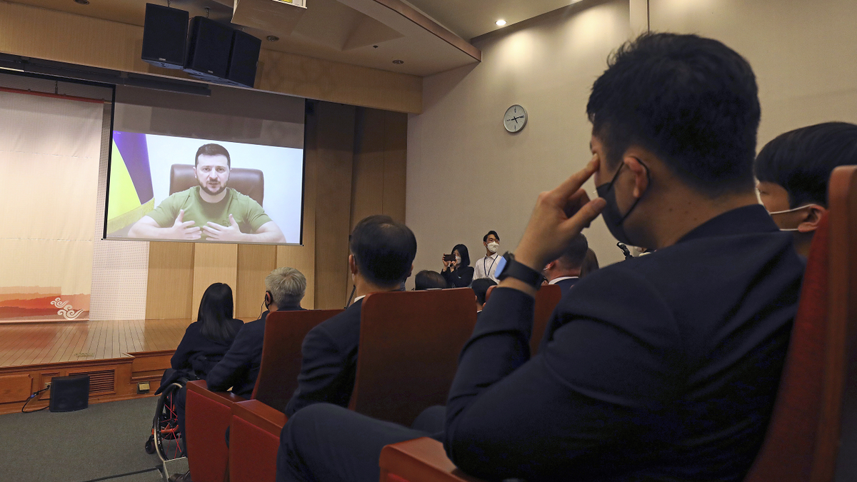 Ukrainian President Volodymyr Zelenskyy addresses members of the South Korea Parliament via video link at the National assembly on Monday.