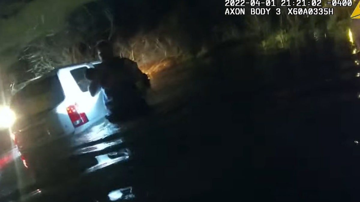 Maryland police shared video of officers jumping into action to rescue a 9-month-old, a toddler and two adults trapped inside a half-submerged vehicle that crashed inti a pond last week.