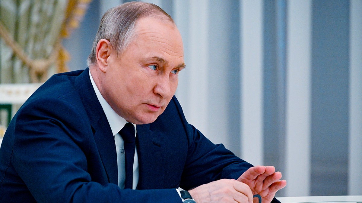 Russian President Vladimir Putin speaks to U.N. Secretary-General Antonio Guterres during their meeting in the Kremlin, in Moscow, Russia, Tuesday, April 26, 2022. (Vladimir Astapkovich, Sputnik, Kremlin Pool Photo via AP)