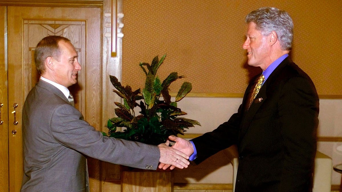 U.S. President Bill Clinton shakes hands with Russian President Vladimir Putin at the Assara Guest House while attending the Asian-Pacific Economic Cooperation annual meeting in Brunei, November 15, 2000.