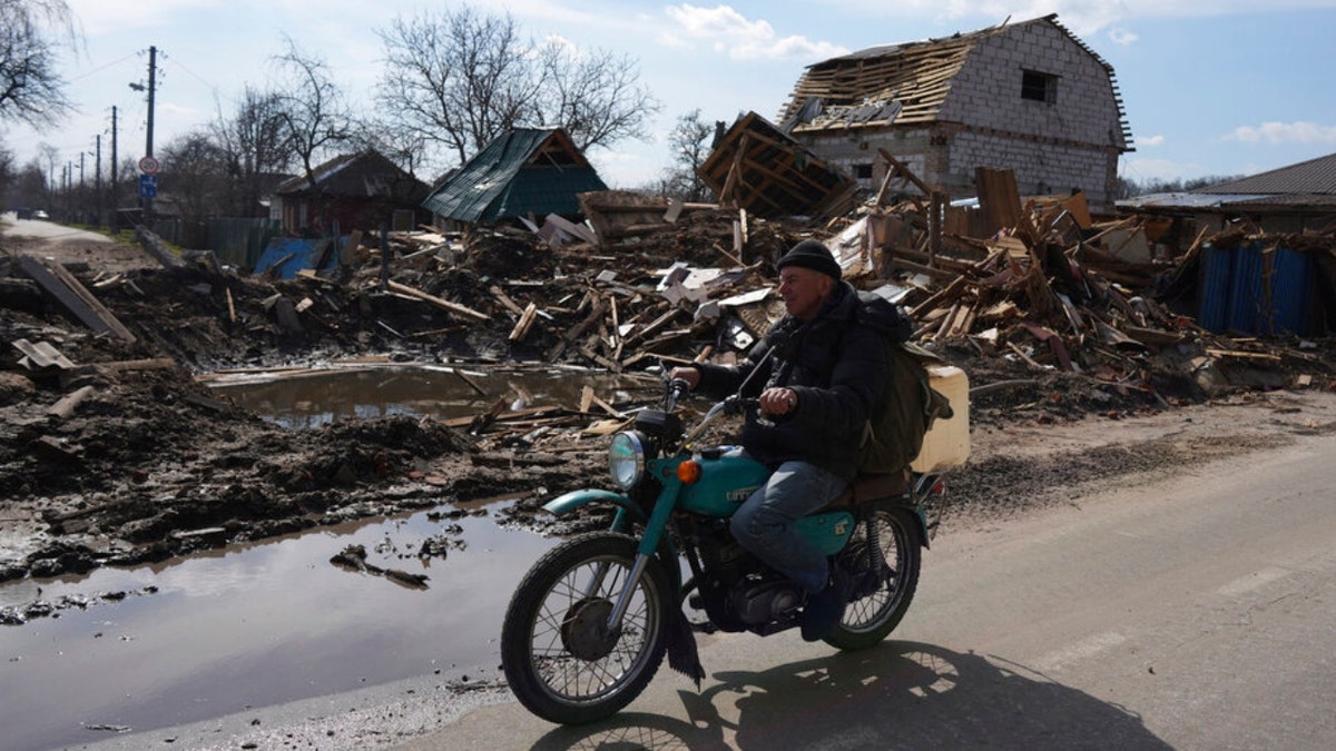 A man rides a motorbike in Chernihiv