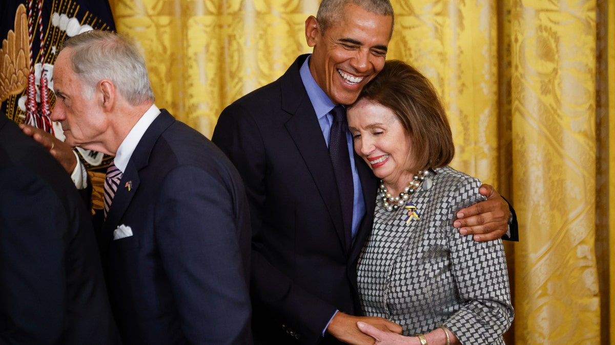 WASHINGTON, DC - APRIL 5: Former President Barack Obama hugs Speaker of the House Nancy Pelosi (D-CA) at the end of an event to mark the 2010 passage of the Affordable Care Act in the East Room of the White House on April 5, 2022 in Washington, DC. With then-Vice President Joe Biden by his side, Obama signed 'Obamacare' into law on March 23, 2010. (Photo by Chip Somodevilla/Getty Images)