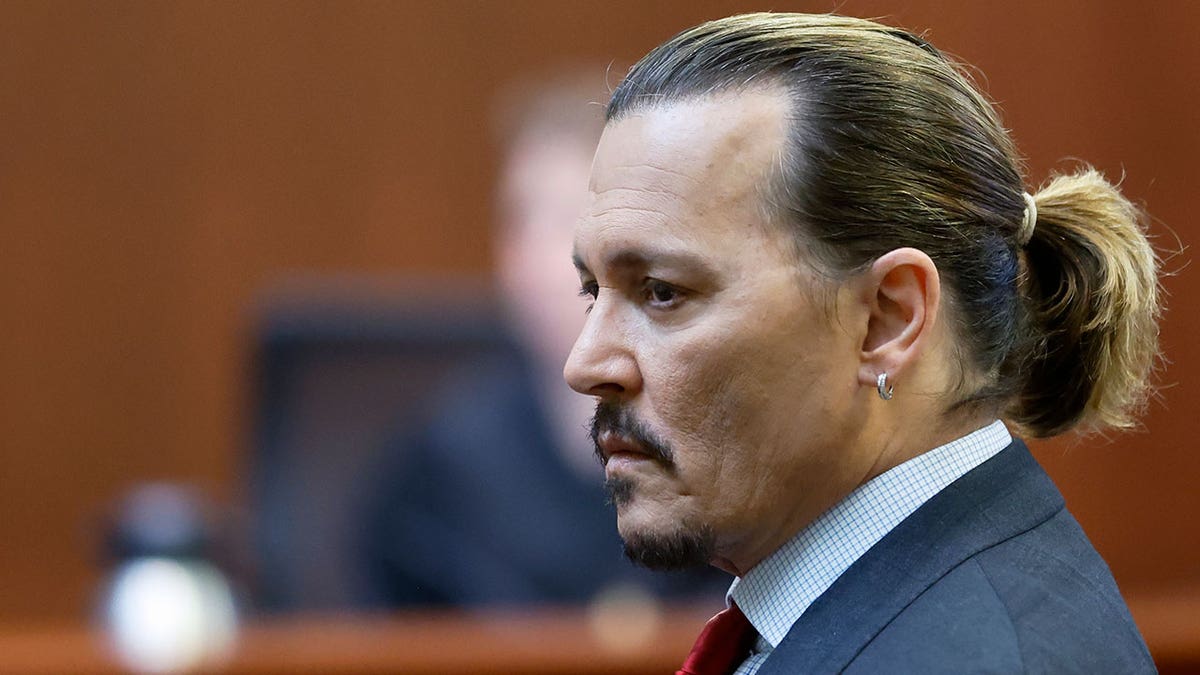 Actor Johnny Depp listens in the courtroom at the Fairfax County Circuit Court in Fairfax, Va. (Jonathan Ernst/Pool Photo via AP)