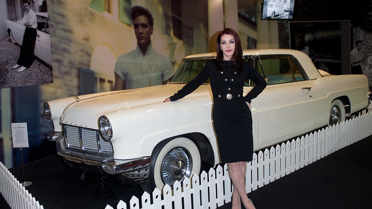 Priscilla Presley with Elvis Presley's Continental