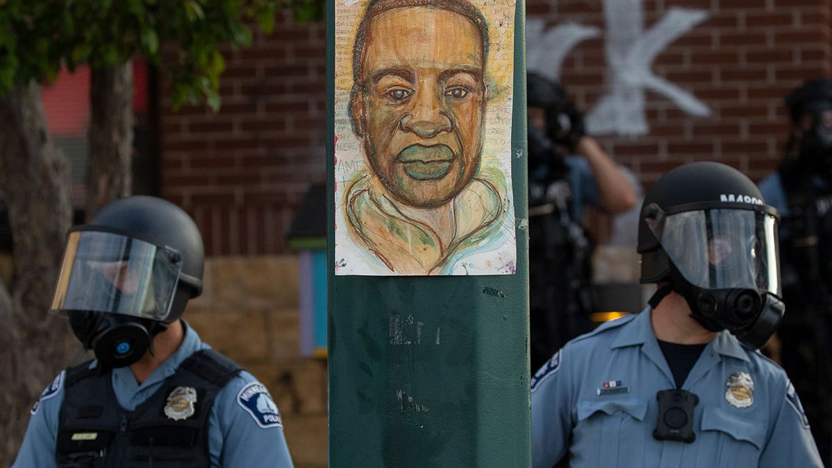 Minneapolis police standing by George Floyd photo