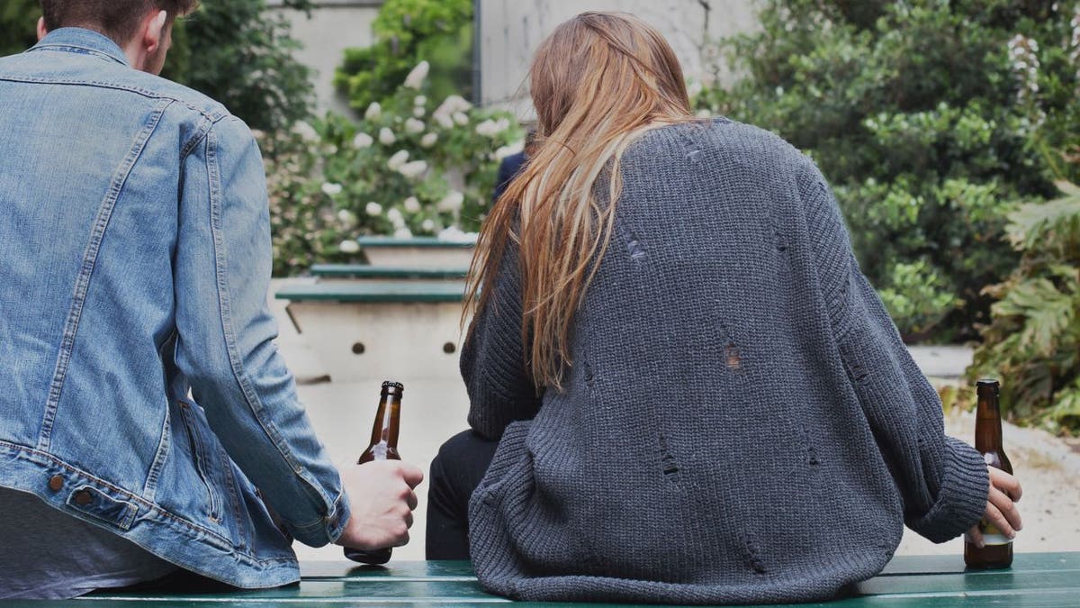 young people drinking beer outside