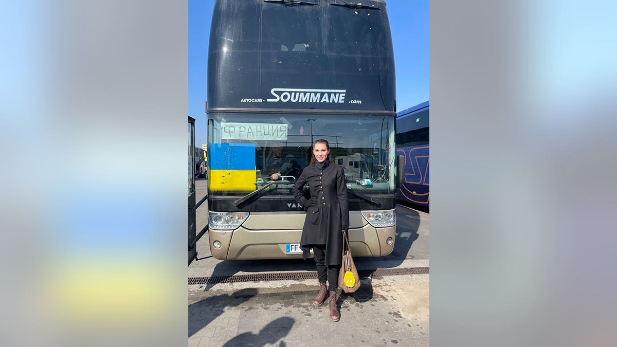 Olga Litvinenko with bus at Ukraine refugee center in Przemysl, Poland