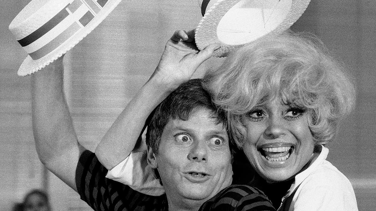 Robert Morse, left, and  Carol Channing appear during a rehearsal for the road company production of "Sugar Babies" in New York on July 18, 1977.