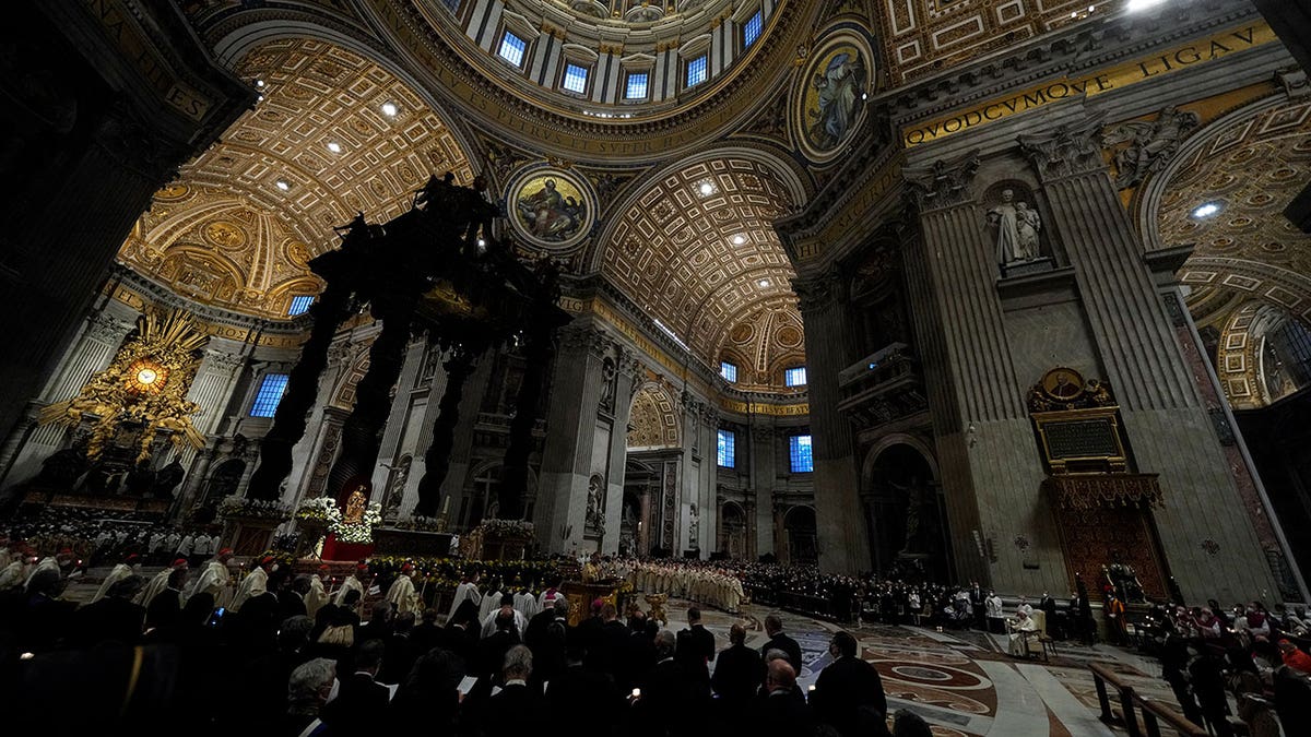 The Easter vigil ceremony in St. Peter's Basilica at the Vatican, Saturday, April 16, 2022.