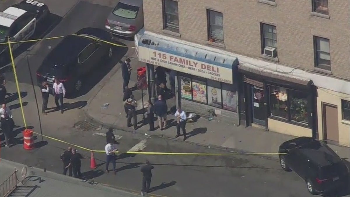 Authorities at the scene of a shooting in which a Yonkers, New York police officer was shot and a suspect was killed. A Yonkers police officer was shot Wednesday while trying to arrest three suspects during a joint investigation with the FBI. The suspect was killed when an FBI agent returned fire. 