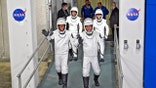 SpaceX Crew-4 astronauts, from left, pilot Bob Hines, mission specialist Jessica Watkins, commander Kjell Lindgren, and European Space Agency astronaut Samantha Cristoforetti, of Italy, wave as they leave the Operations and Checkout Building for a trip to Launch Complex 39-A Wednesday, April 27, 2022, at the Kennedy Space Center in Cape Canaveral, Fla. The four astronauts will fly to the International Space Station. (AP Photo/John Raoux)