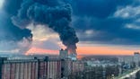 In this photo taken by an anonymous source, smoke rises from oil storage facilities hit by fire in Bryansk, Russia, Monday, April 25, 2022. The Emergencies Ministry said the massive fire at the depot in the city of Bryansk erupted overnight. The oil depot is owned by Transneft-Druzhba, a subsidiary of the Russian state-controlled company Transneft that operates the western-bound Druzhba (Friendship) pipeline carrying crude to Europe, and it wasn't immediately clear if the blaze could affect the deliveries. (Anonymous source via AP)