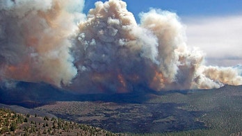 Arizona wildfire triples in size as thousands flee their homes