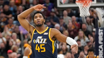 Jazz clinch playoff spot with OT win over Grizzlies
