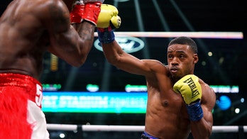 Errol Spence Jr adds 3rd title belt with TKO over WBA champ Yordenis Ugás