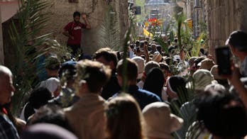 Palm Sunday sees thousands of Christians mark the triumphal entry in Jerusalem amid tensions