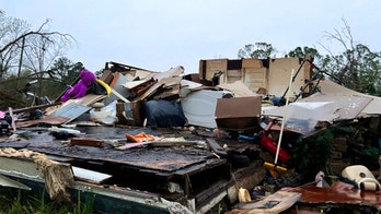 Storms in the South: Residents clear damage from deadly weather