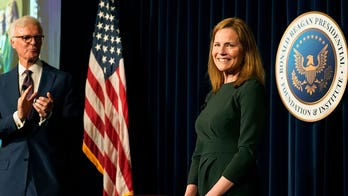 Justice Amy Coney Barrett once climbed priest's fence in high heels to escape news cameras after church