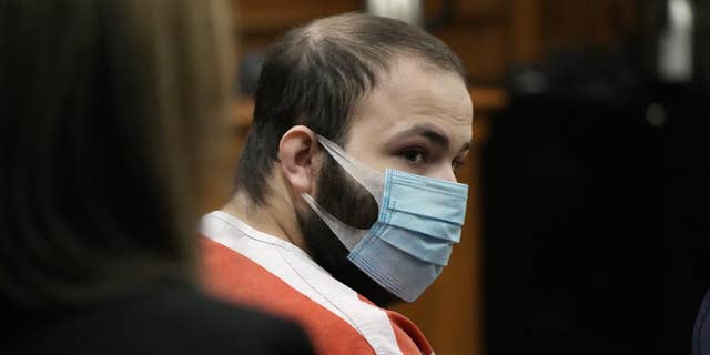 Ahmad Al Aliwi Alissa, the man accused of killing multiple people at a Colorado supermarket in March 2021, is led into a courtroom for a hearing, Sept. 7, 2021, in Boulder, Colorado. A judge ruled Friday, April 15, 2022, that Alissa, charged with killing 10 people at a Colorado supermarket last year is still mentally incompetent to stand trial, further delaying court proceedings in the case.