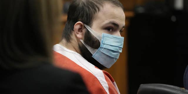 Ahmad Al Aliwi Alissa, the man accused of killing multiple people at a Colorado supermarket in March 2021, is led into a courtroom for a hearing, Sept. 7, 2021, in Boulder, Colorado. A judge ruled Friday, April 15, 2022, that Alissa, charged with killing 10 people at a Colorado supermarket last year is still mentally incompetent to stand trial, further delaying court proceedings in the case.